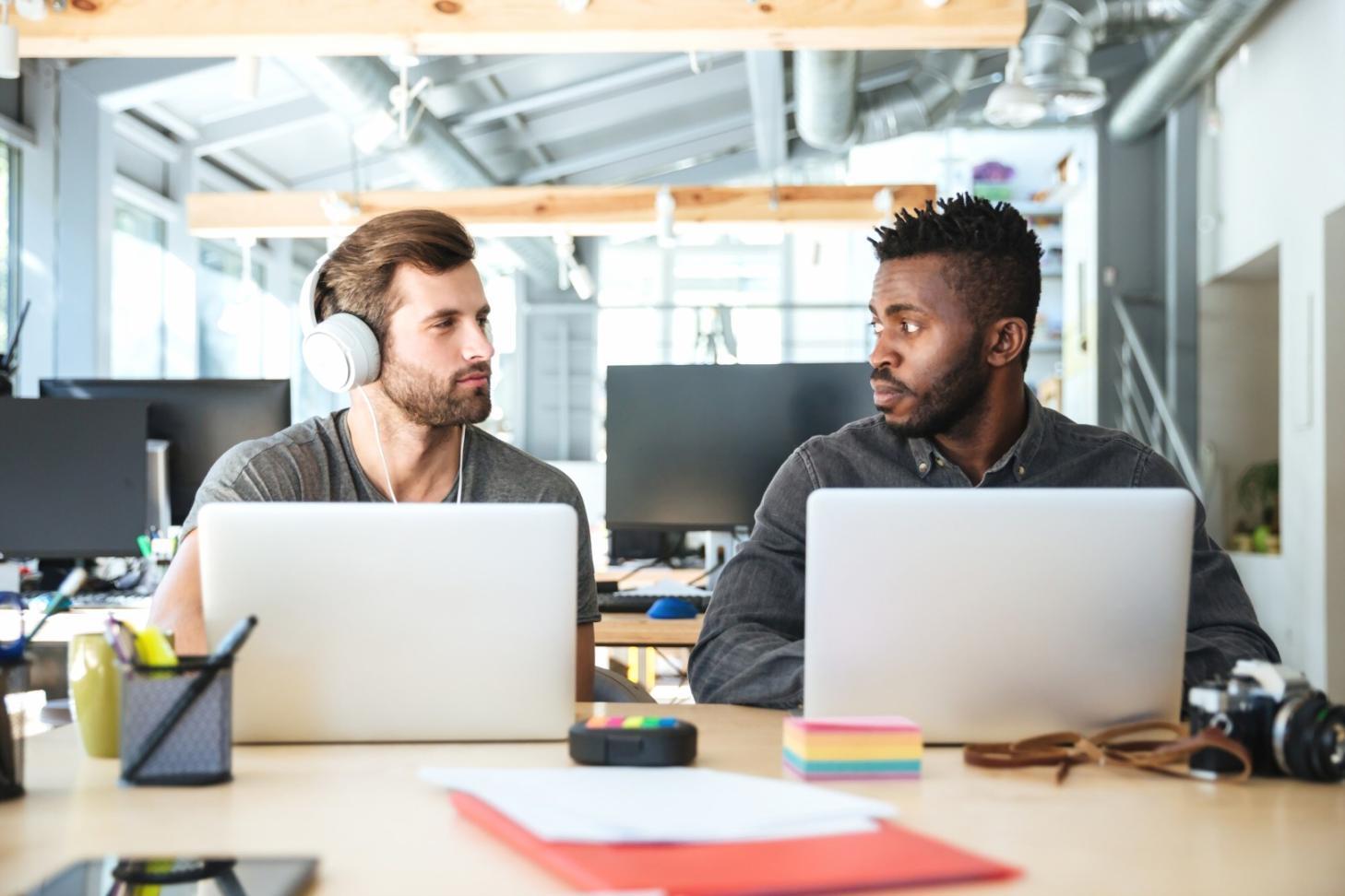 Modern office setup with testing documentation and collaborative tools